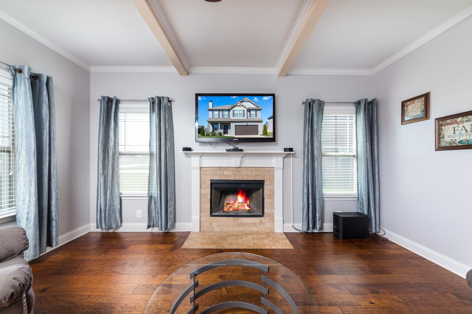 2340 Pea Ridge Road Clarksville, TN 37040 - Photo 5 of 25 a living room with furniture and a fireplace