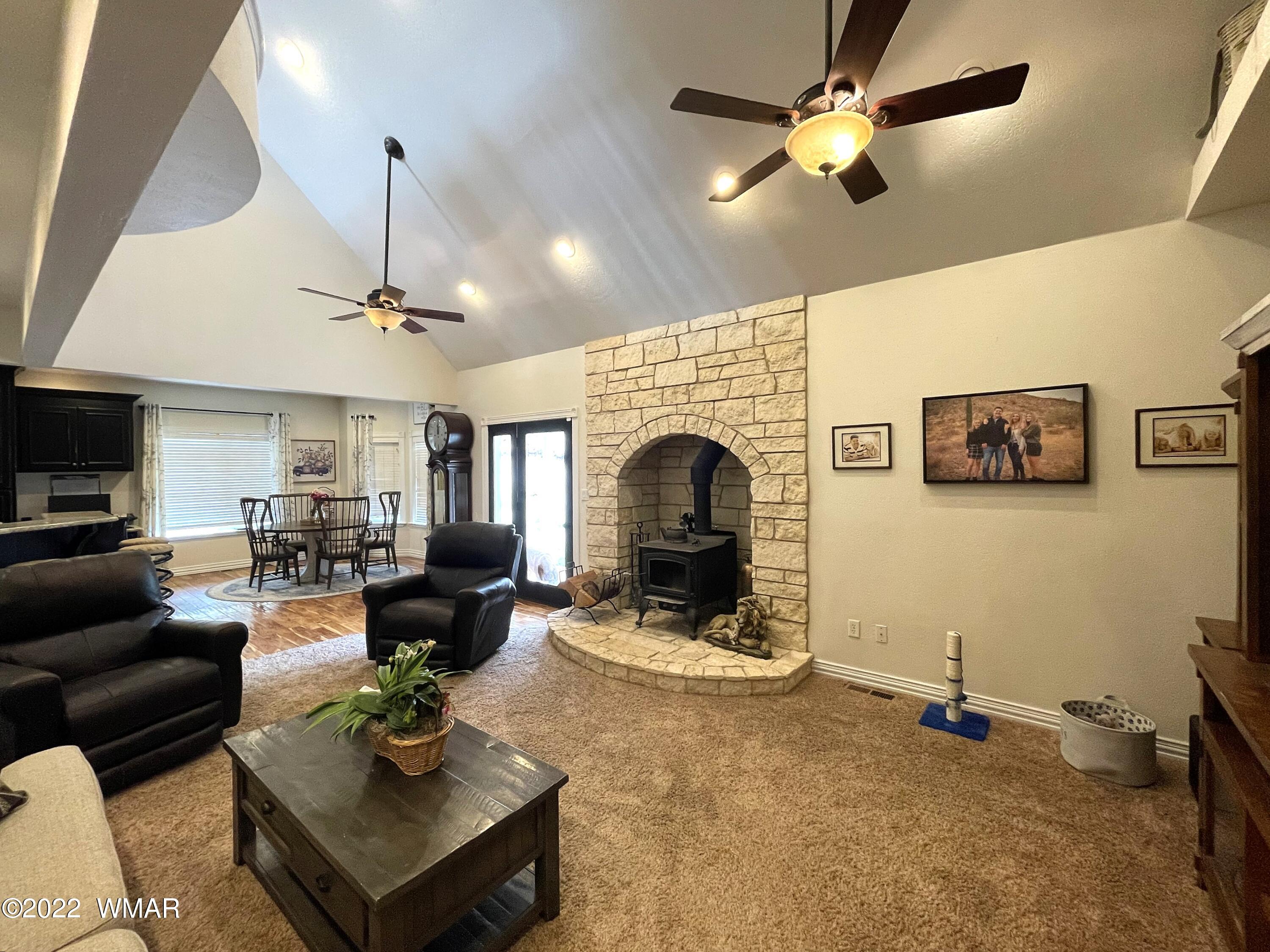 1713 Snowline Road Eagar, AZ 85925 - Photo 15 of 53 a living room with furniture and a fireplace