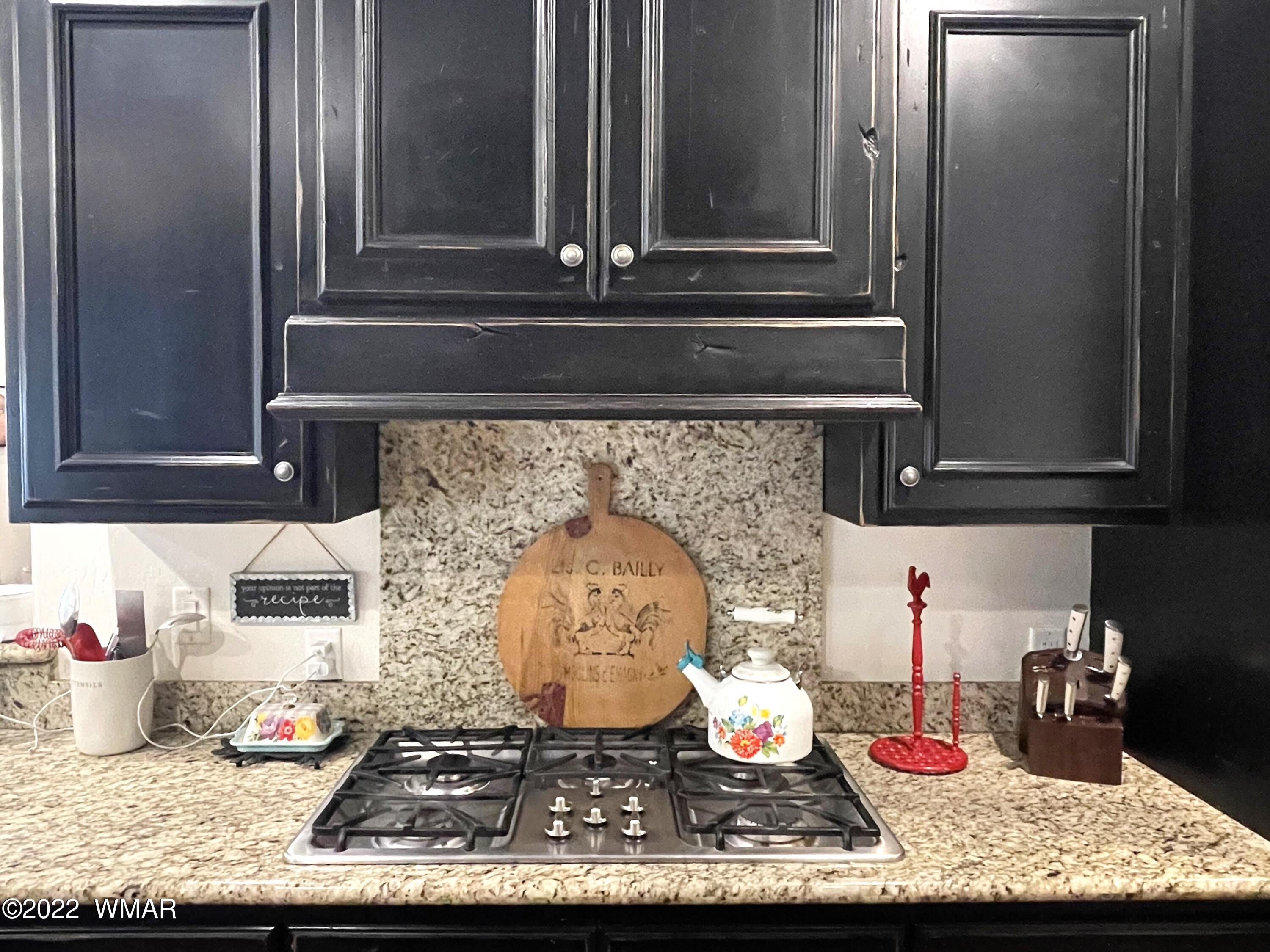 1713 Snowline Road Eagar, AZ 85925 - Photo 20 of 53 a kitchen with a stove and cabinets