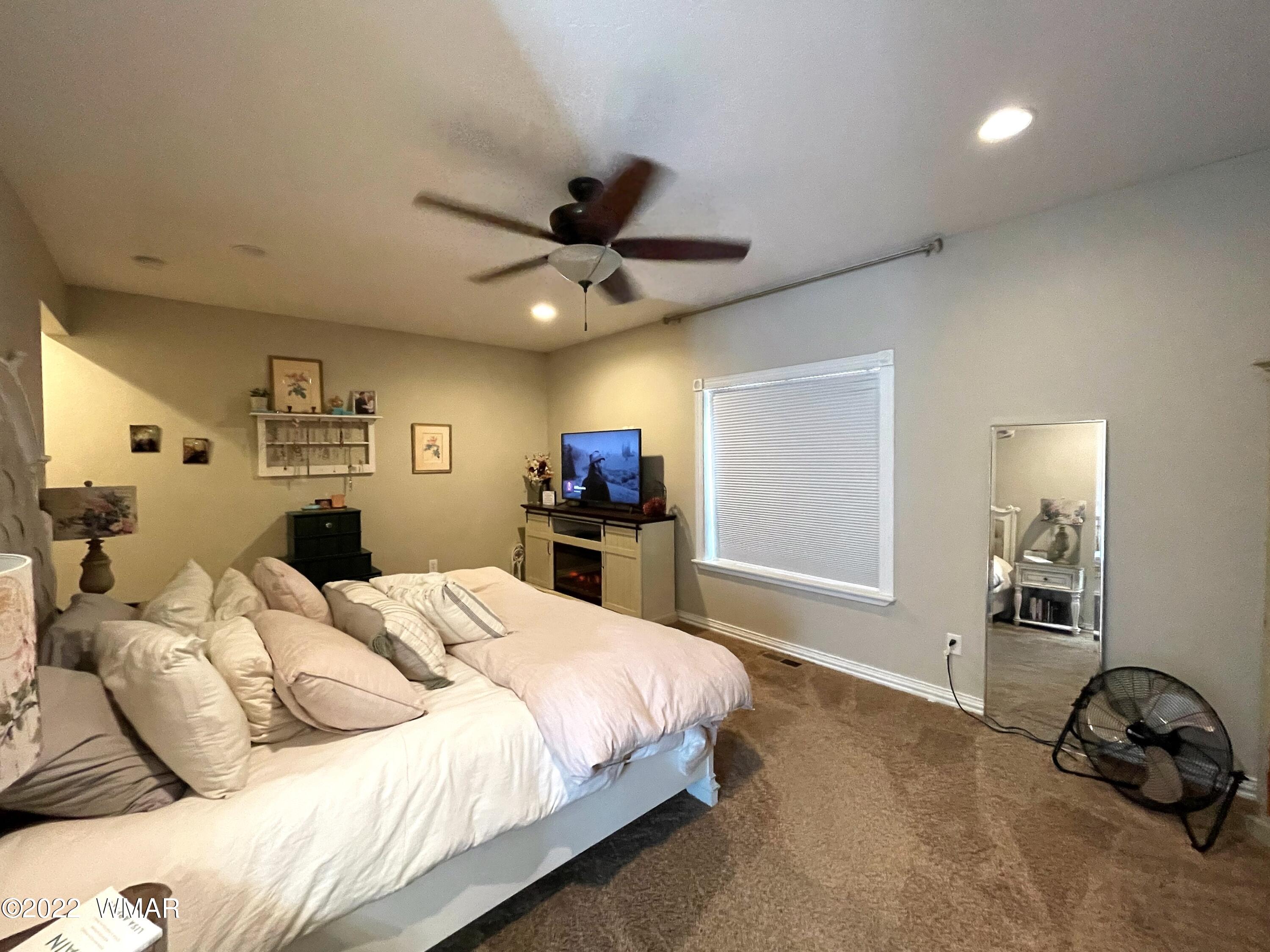 1713 Snowline Road Eagar, AZ 85925 - Photo 26 of 53 a bedroom with a bed and a window