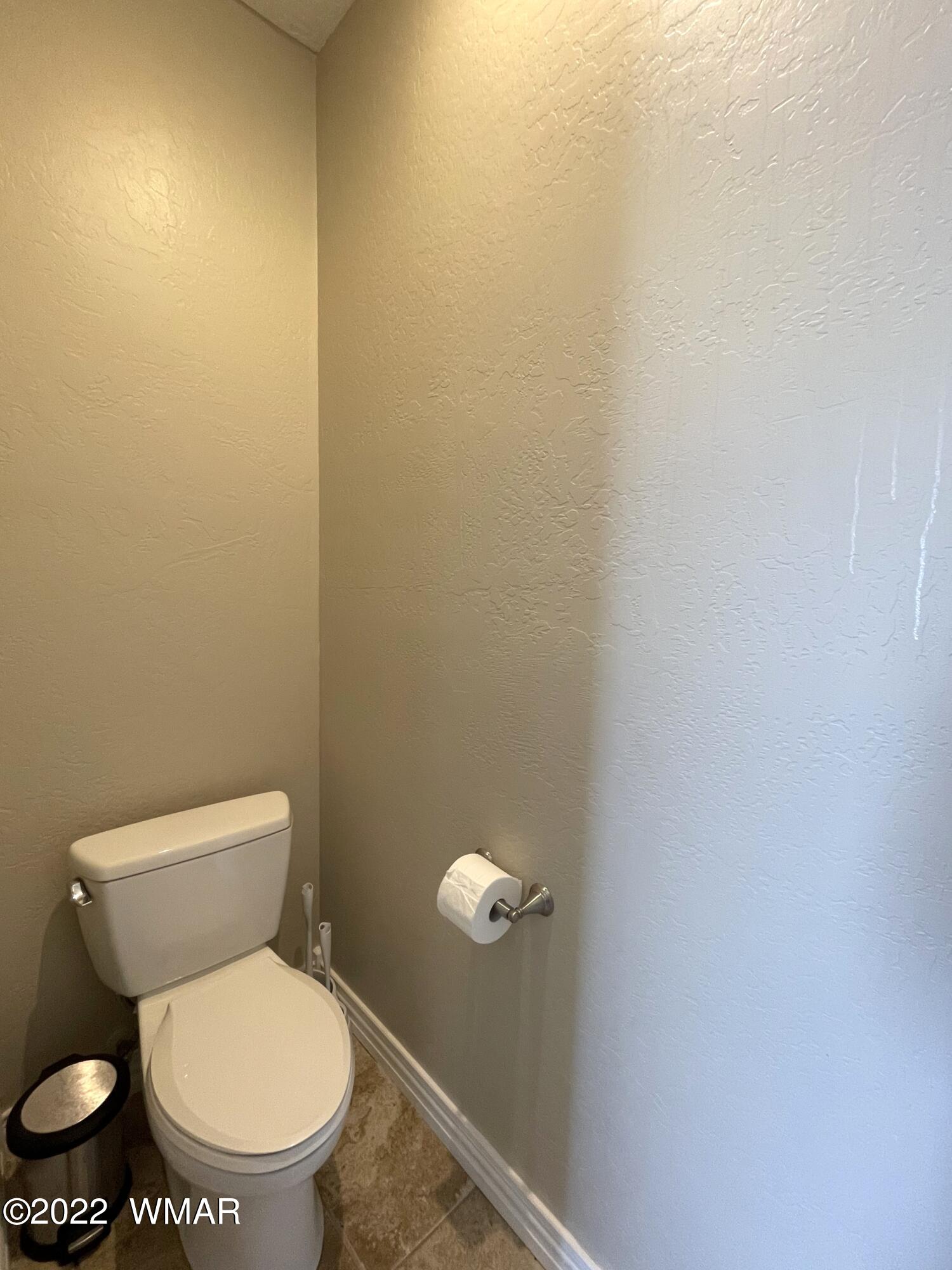 1713 Snowline Road Eagar, AZ 85925 - Photo 30 of 53 a white toilet sitting next to a white wall