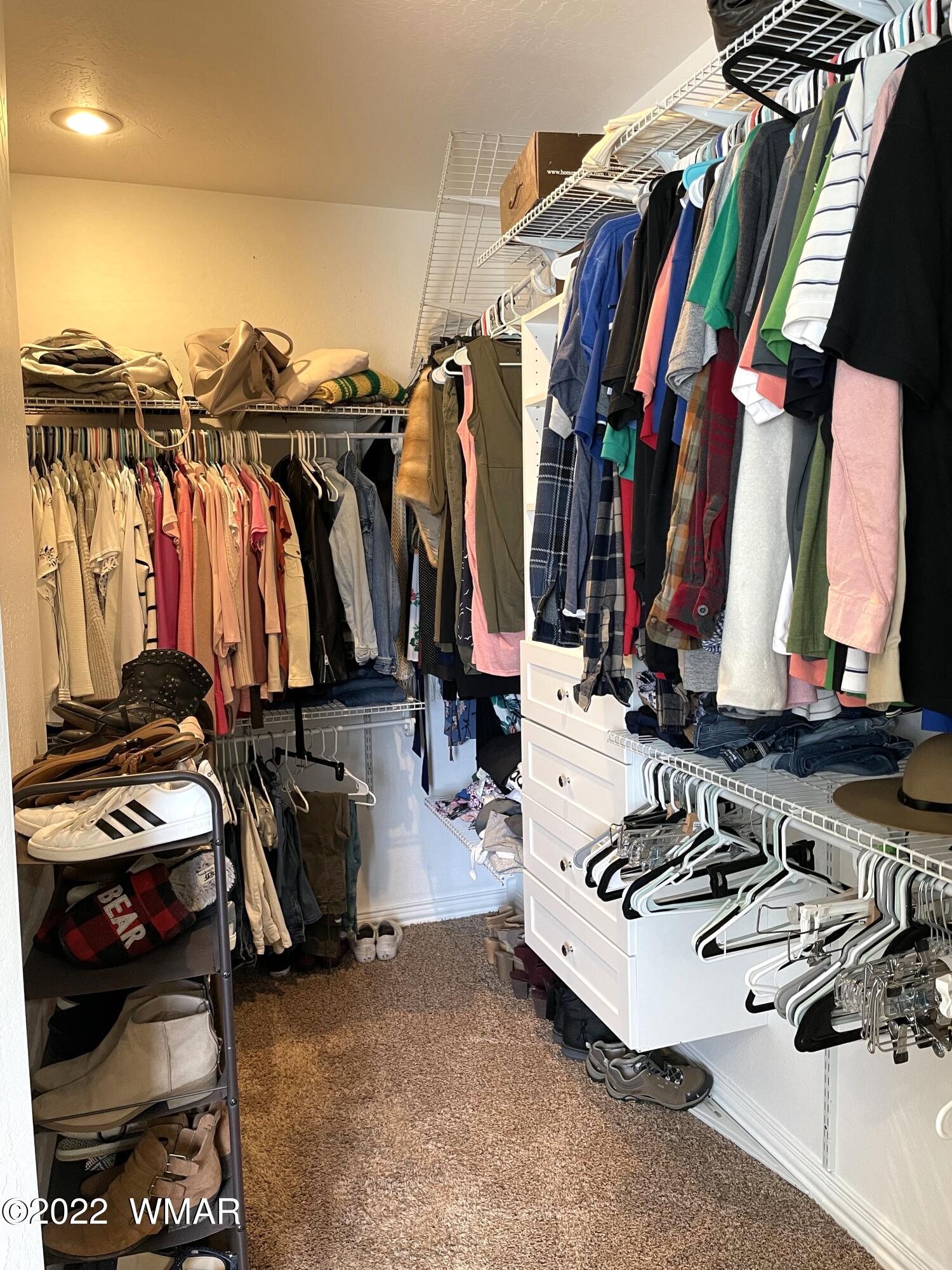 1713 Snowline Road Eagar, AZ 85925 - Photo 31 of 53 a view of walk in closet with clothes and shoes