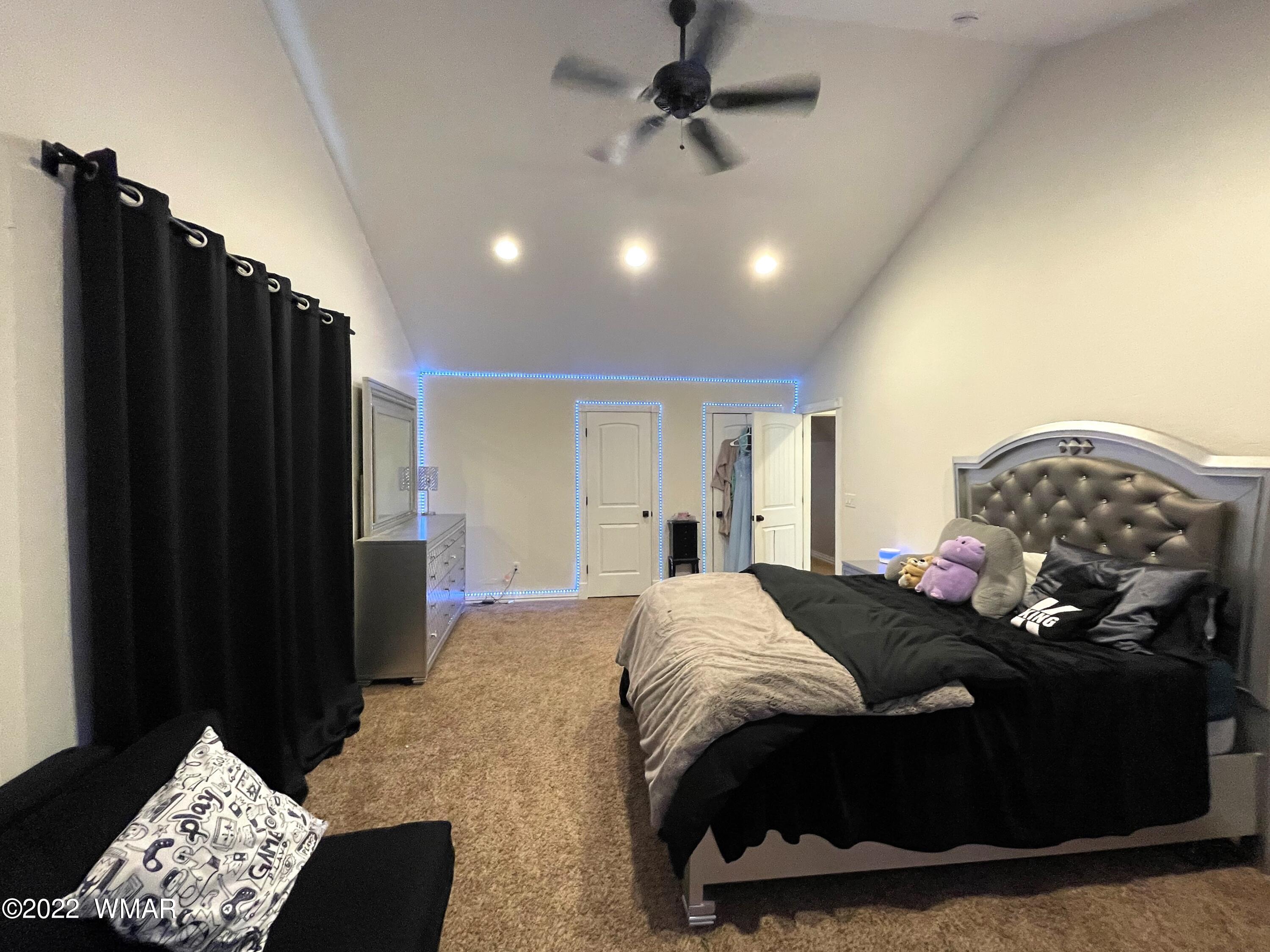 1713 Snowline Road Eagar, AZ 85925 - Photo 40 of 53 a bedroom with a bed dresser and a window