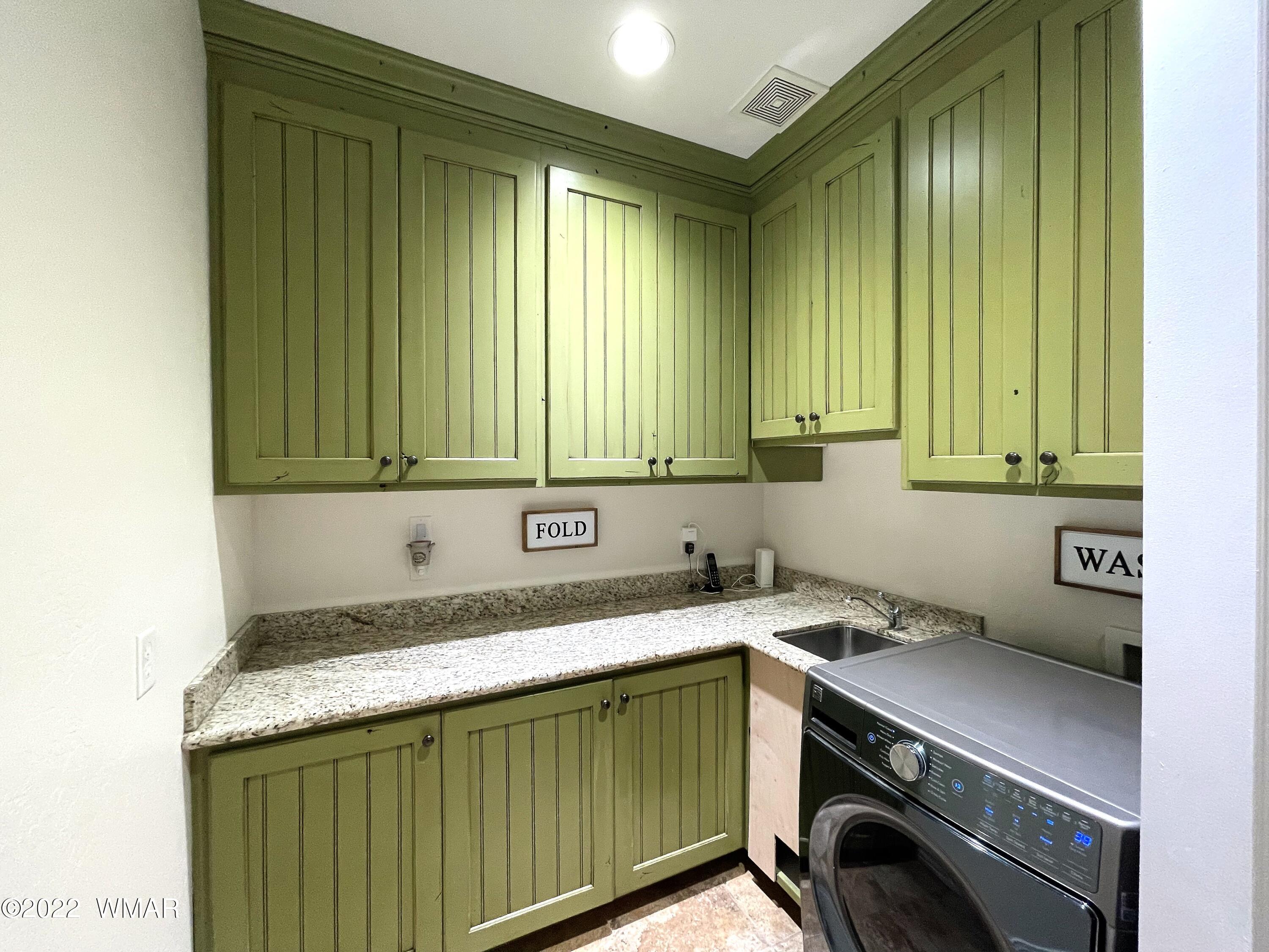 1713 Snowline Road Eagar, AZ 85925 - Photo 48 of 53 a utility room with a sink