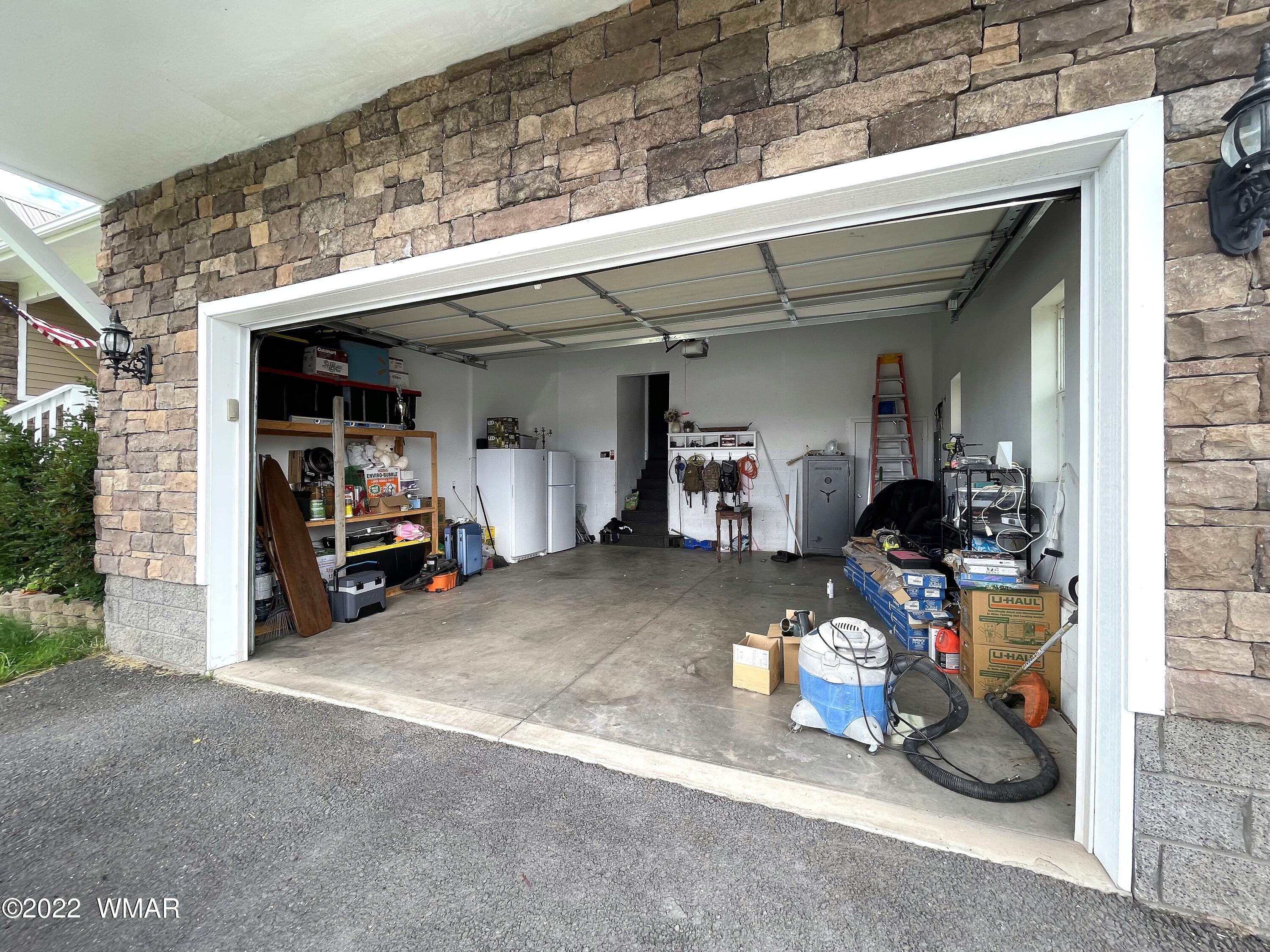 1713 Snowline Road Eagar, AZ 85925 - Photo 49 of 53 a view of a storage room with a lot of stuff