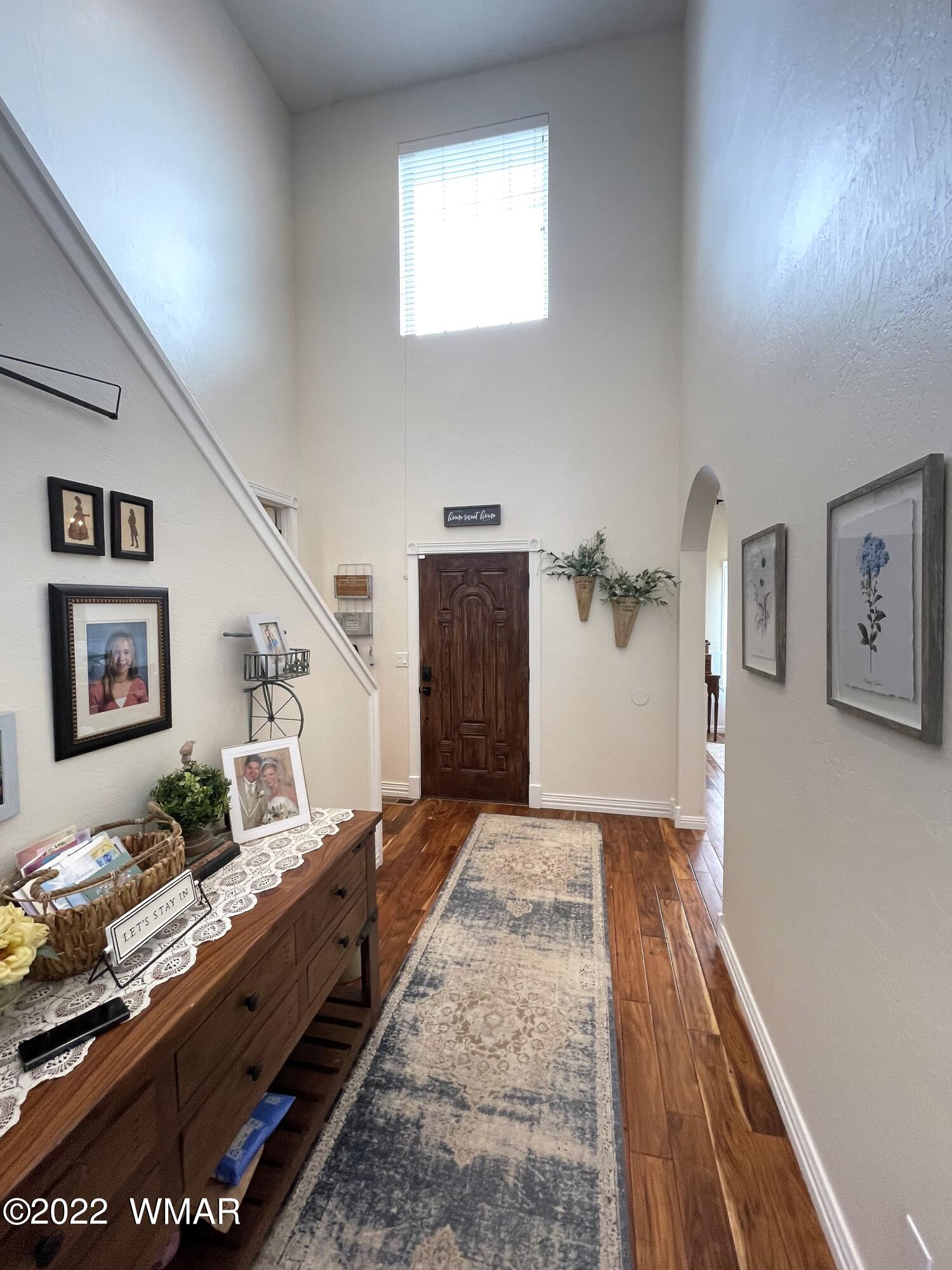 1713 Snowline Road Eagar, AZ 85925 - Photo 5 of 53 a living room with furniture and painting on the wall