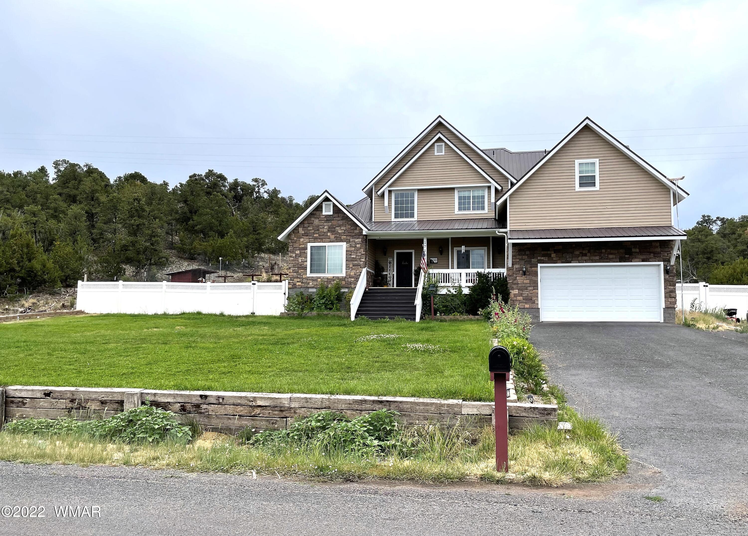 1713 Snowline Road Eagar, AZ 85925 - Photo 53 of 53 a front view of a house with a yard