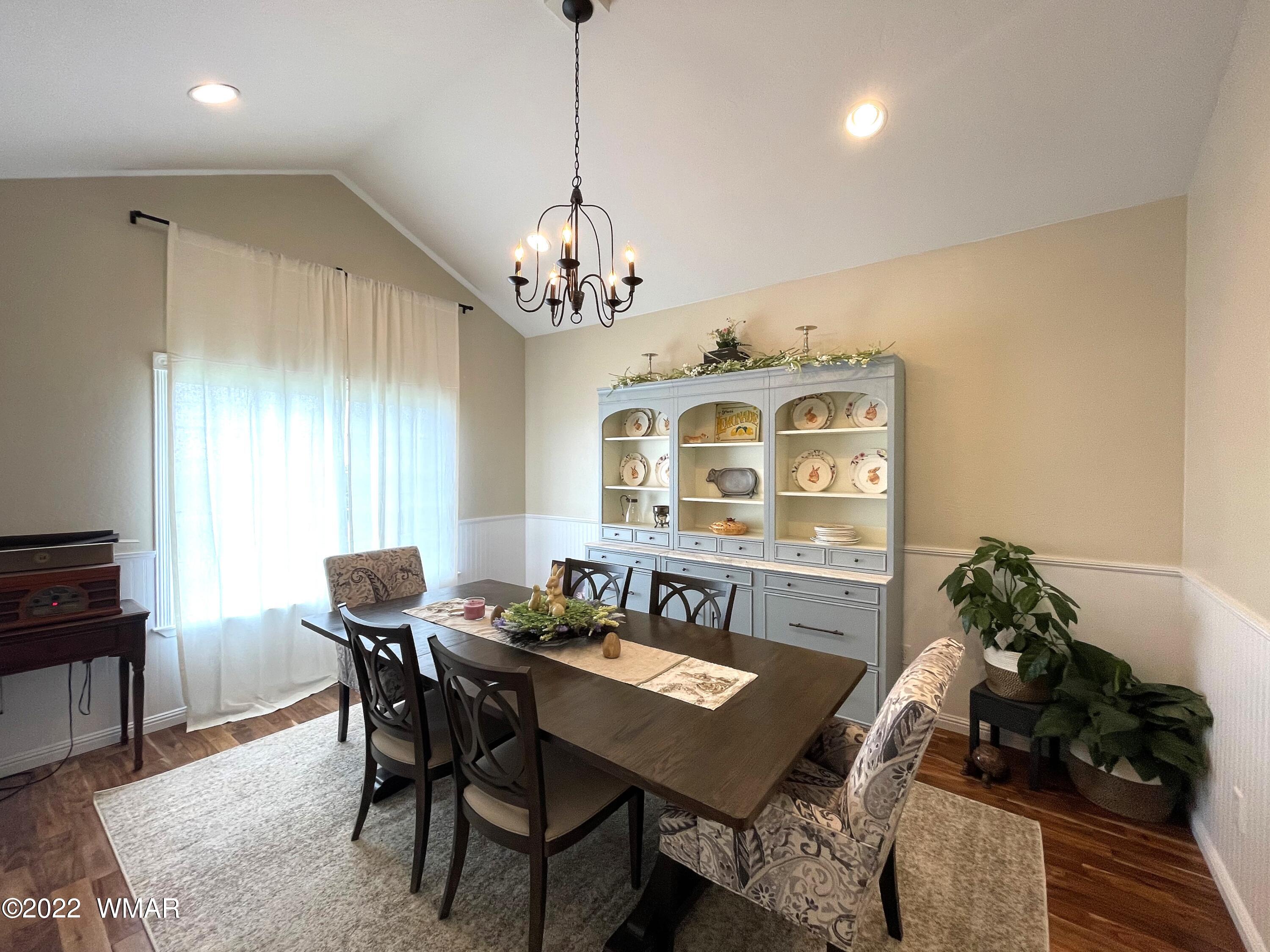1713 Snowline Road Eagar, AZ 85925 - Photo 6 of 53 a view of a dining room with furniture window and wooden floor