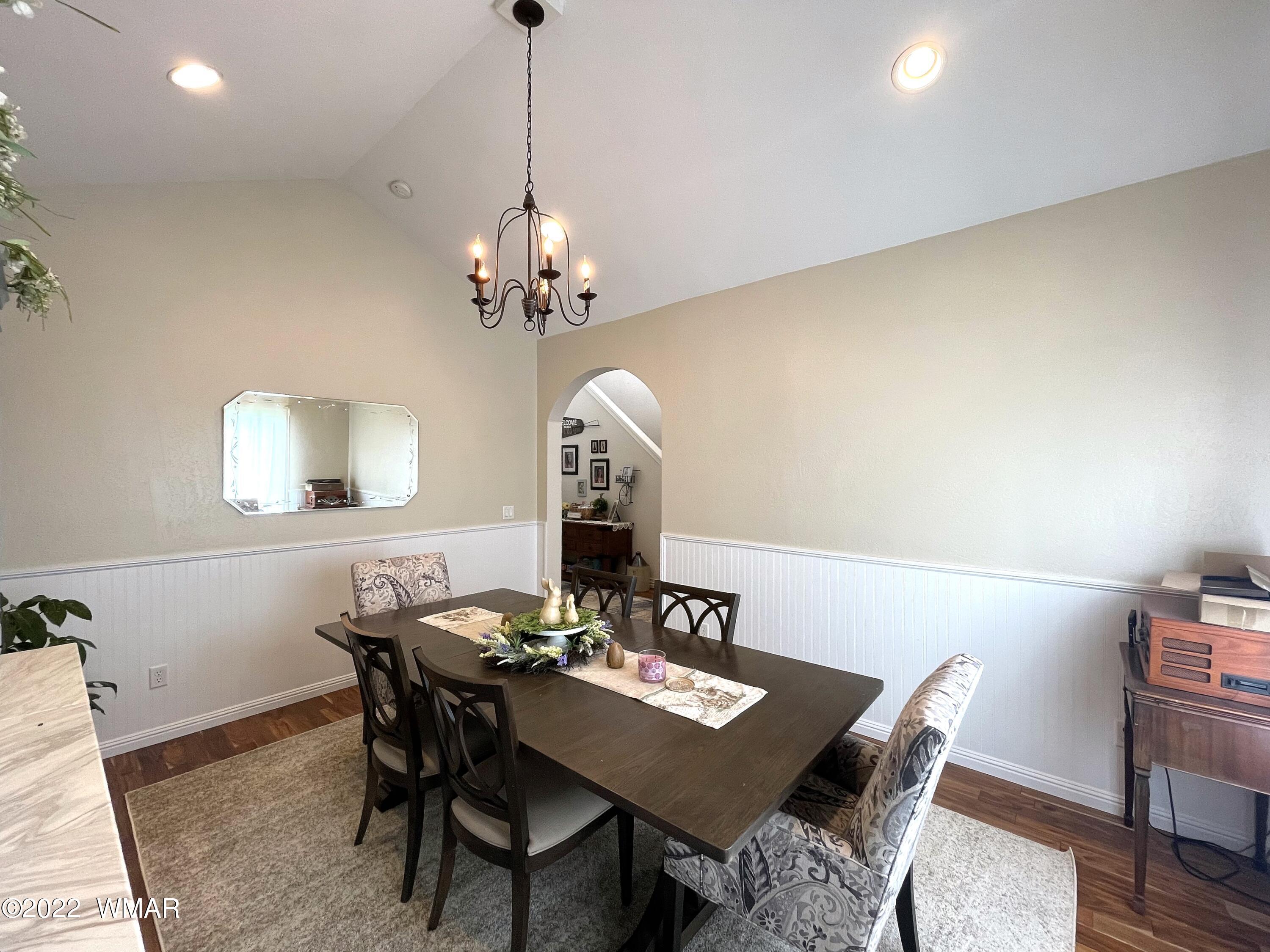1713 Snowline Road Eagar, AZ 85925 - Photo 7 of 53 a view of a dining room with a table and chairs