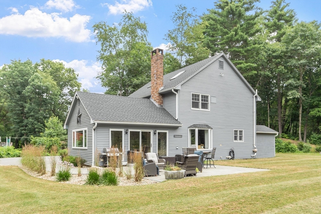 241 Reservoir Road Lunenburg, MA 01462 - Photo 17 of 40 a front view of house with yard and trees around
