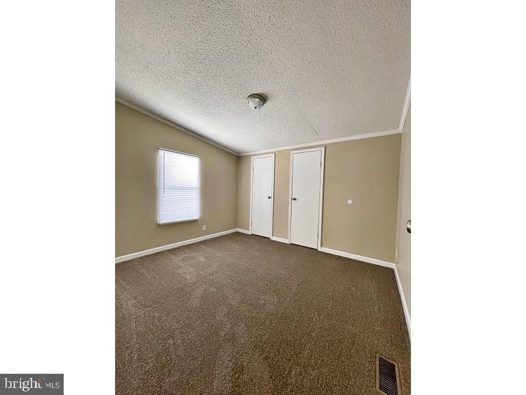 7193 Whiteleysburg Road Harrington, DE 19952 - Photo 9 of 13 a view of an empty room with a window