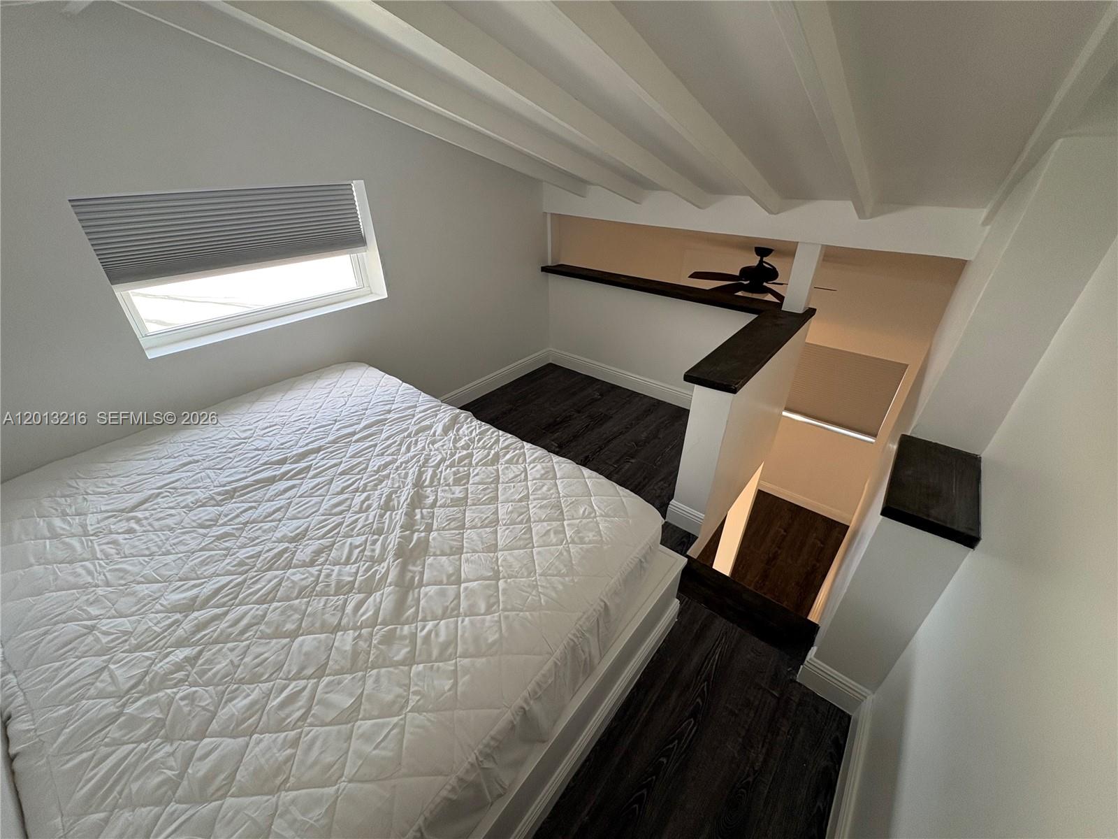 250 Southwest 19th Road Miami, FL 33129 - Photo 21 of 22 a bedroom with a bed and a window