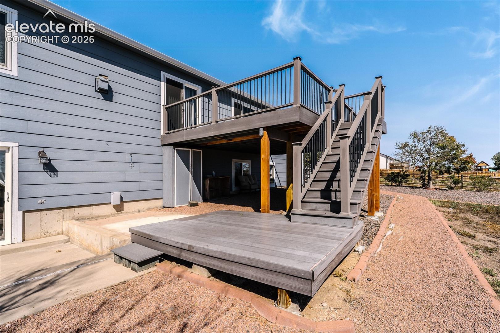 7869 Fort Smith Road Peyton, CO 80831 - Photo 43 of 50 Backyard deck and lower level patio.