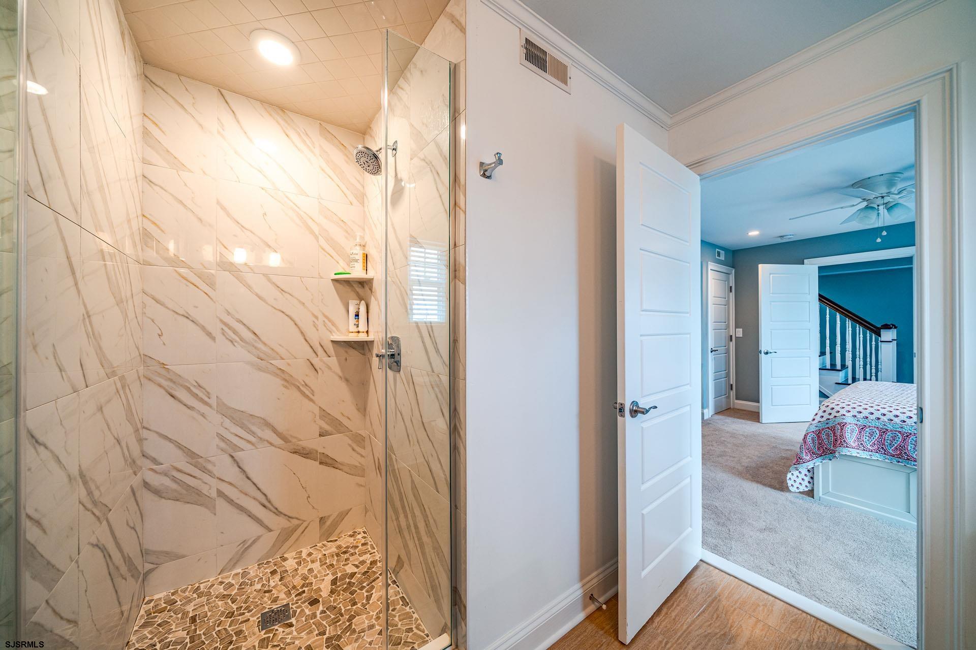 84 East Station Road Ocean City, NJ 08226 - Photo 14 of 30 a bathroom with a bathtub and shower