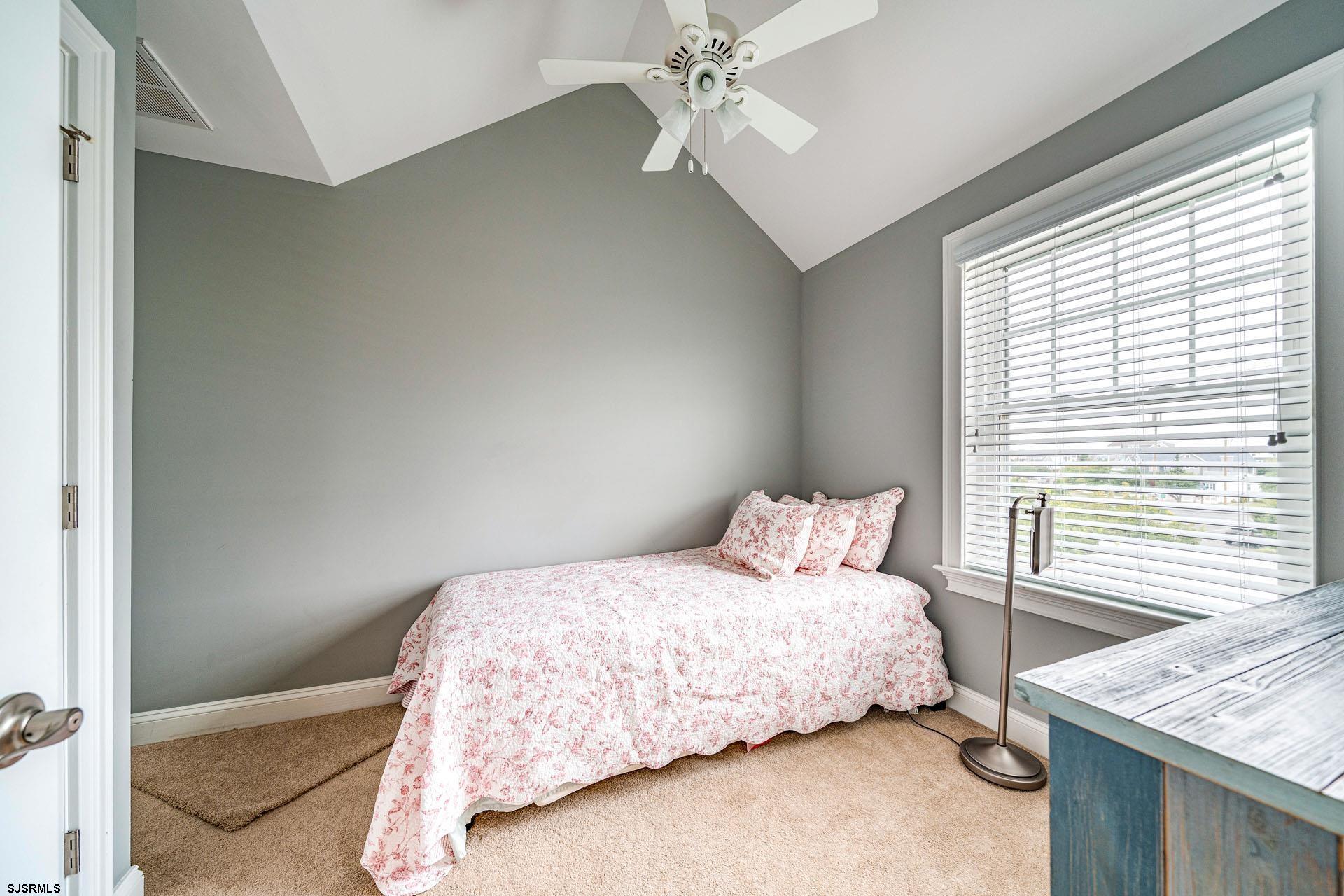 84 East Station Road Ocean City, NJ 08226 - Photo 18 of 30 a bedroom with a bed and a window