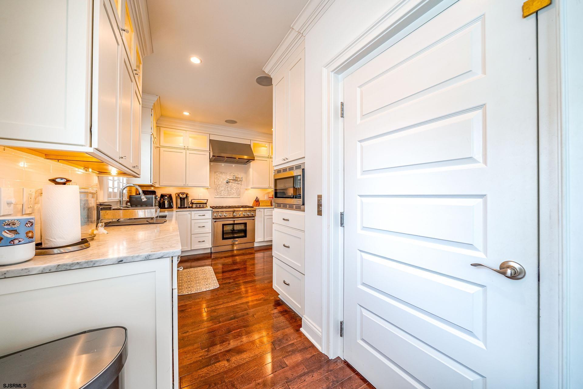 84 East Station Road Ocean City, NJ 08226 - Photo 8 of 30 a kitchen with stainless steel appliances cabinets and a walk in closet