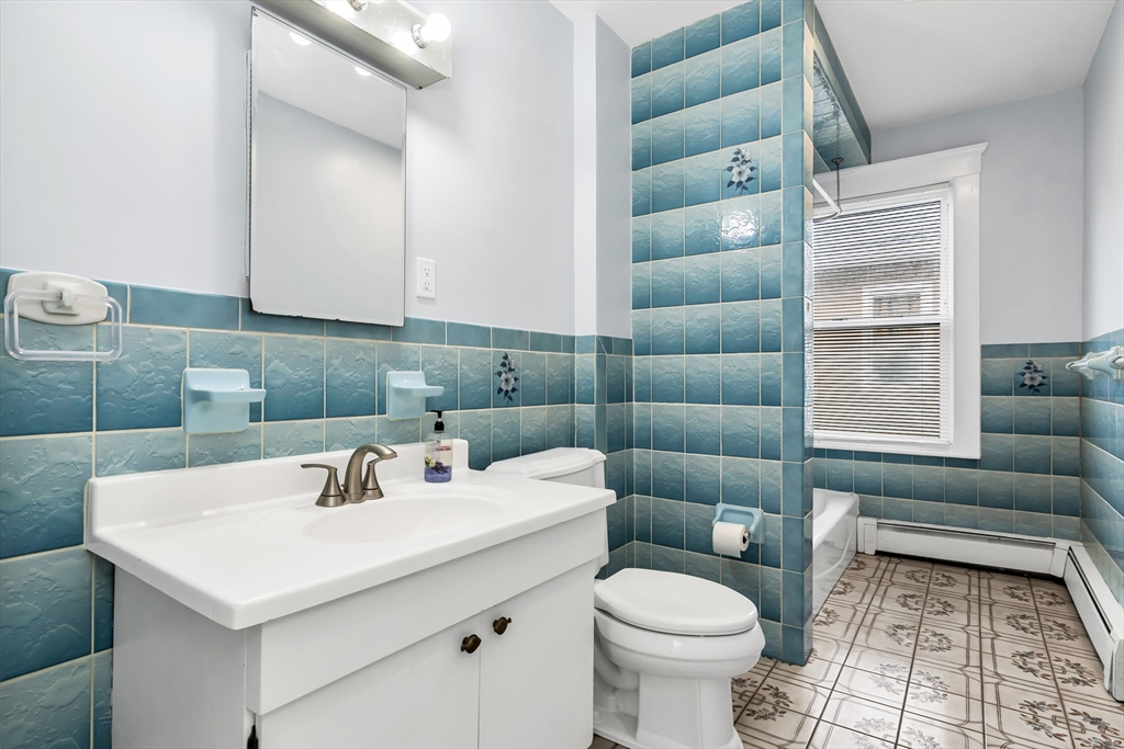 32-34 Magnolia Street, Unit 2 Lawrence, MA 01841 - Photo 12 of 29 a bathroom with a sink toilet and a bathtub