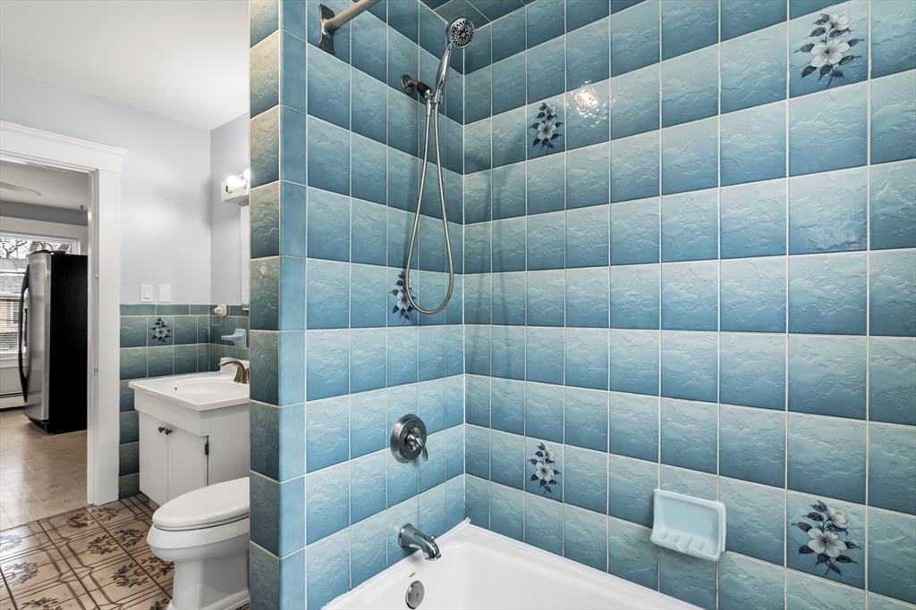 32-34 Magnolia Street, Unit 2 Lawrence, MA 01841 - Photo 14 of 29 a bathroom with a toilet tub and shower