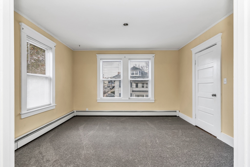 32-34 Magnolia Street, Unit 2 Lawrence, MA 01841 - Photo 19 of 29 an empty room with windows