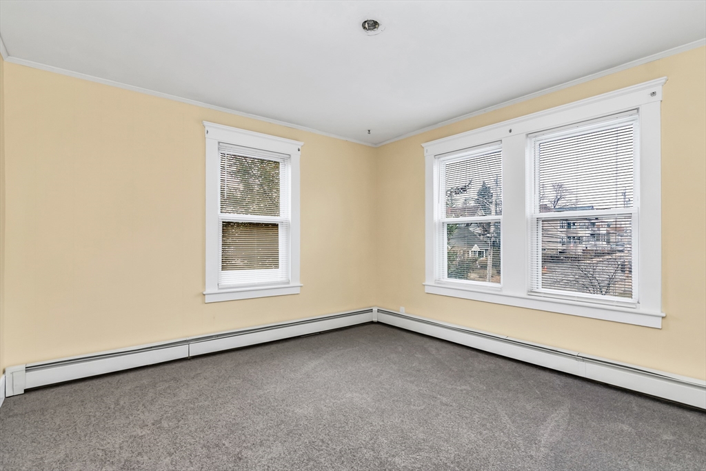 32-34 Magnolia Street, Unit 2 Lawrence, MA 01841 - Photo 20 of 29 an empty room with a window