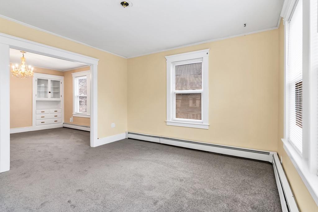 32-34 Magnolia Street, Unit 2 Lawrence, MA 01841 - Photo 21 of 29 an empty room with windows
