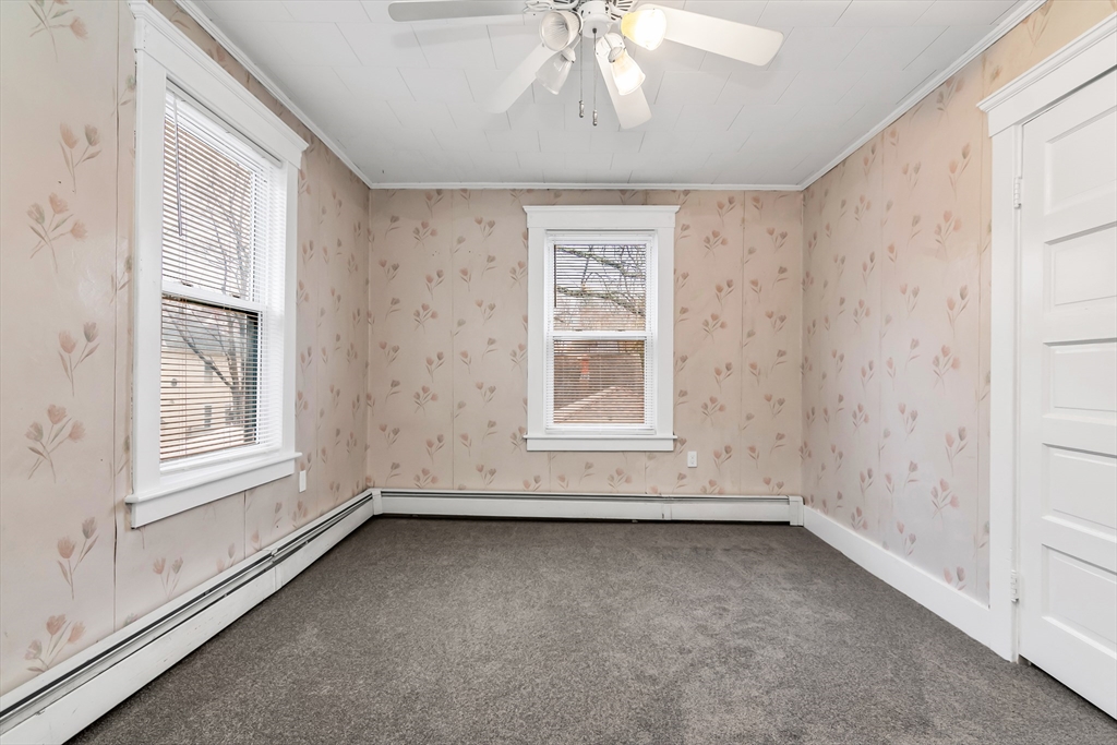 32-34 Magnolia Street, Unit 2 Lawrence, MA 01841 - Photo 23 of 29 an empty room with a empty space and windows