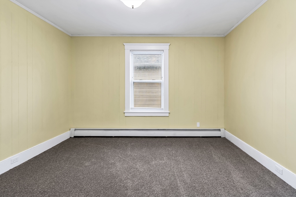 32-34 Magnolia Street, Unit 2 Lawrence, MA 01841 - Photo 26 of 29 an empty room with a window