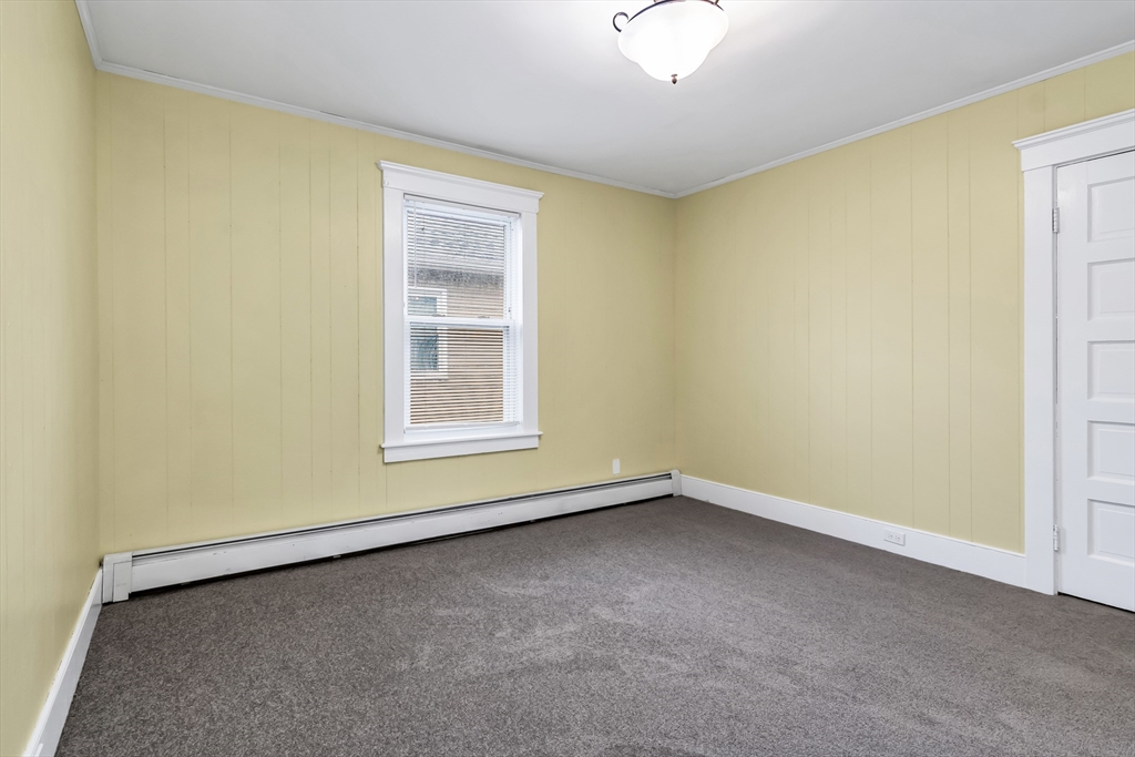 32-34 Magnolia Street, Unit 2 Lawrence, MA 01841 - Photo 27 of 29 an empty room with a window