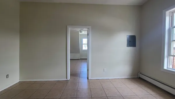 a view of an empty room and window