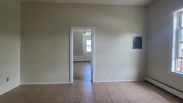 a view of an empty room and window