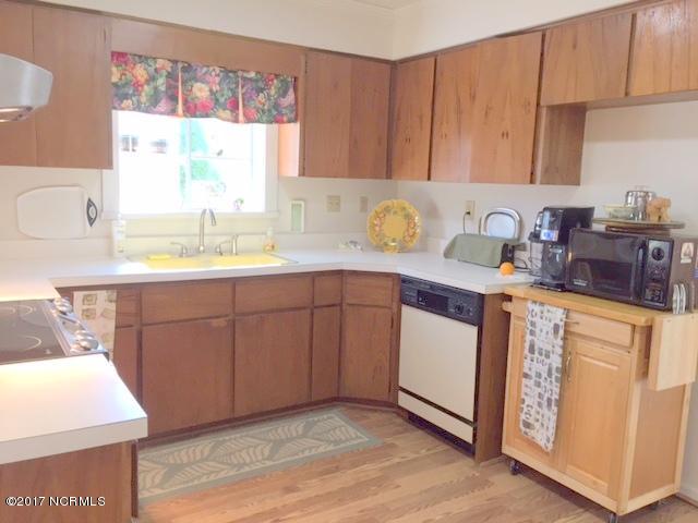7573 Heritage Road Spring Hope, NC 27882 - Photo 11 of 21 Bright open kitchen has a solarium window above sink....lots of cabinet space.
