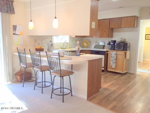 7573 Heritage Road Spring Hope, NC 27882 - Photo 12 of 21 Kitchen boasts an eat on bar ...open to den area...lots of room for family time together.