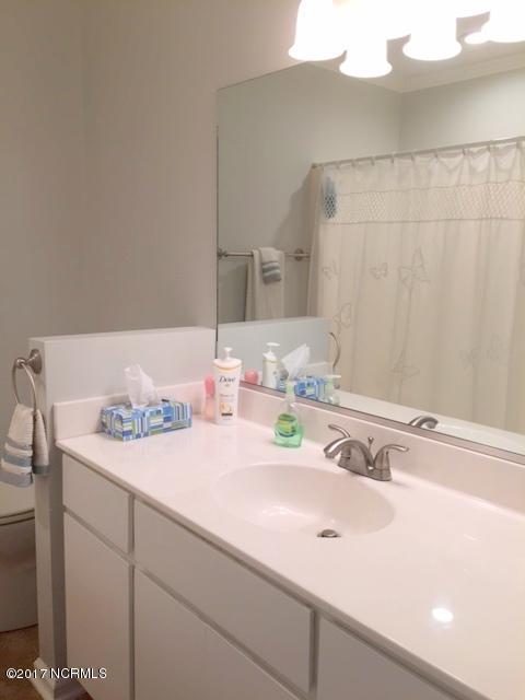 7573 Heritage Road Spring Hope, NC 27882 - Photo 16 of 21 Hall bath features new vanity and fixtures and new paint.