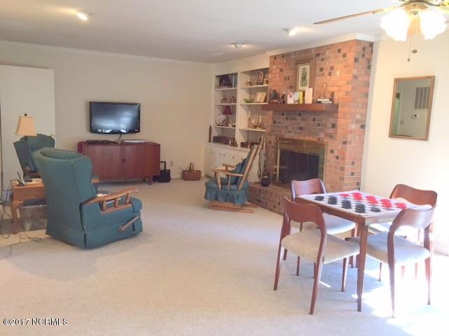 7573 Heritage Road Spring Hope, NC 27882 - Photo 8 of 21 Nice large den with huge brick fireplace. Open to kitchen with breakfast bar.