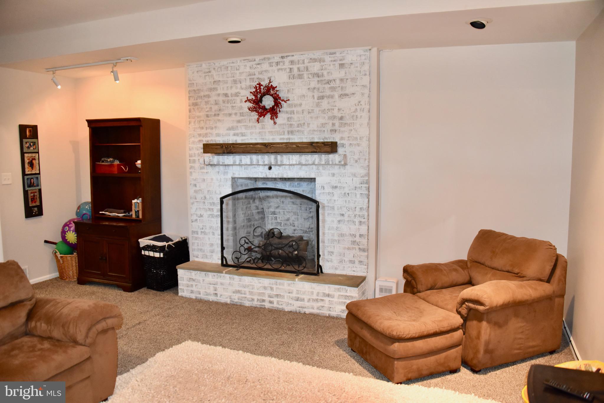 37 Tee Circle Reading, PA 19607 - Photo 28 of 35 Lower Level Family Room W/ Brick Gas Fireplace