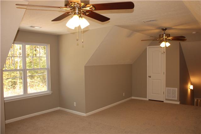 1331 Campbell Ridge Road Kingston Springs, TN 37082 - Photo 12 of 16 an empty room with windows and fan