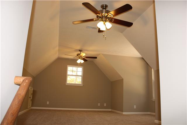 1331 Campbell Ridge Road Kingston Springs, TN 37082 - Photo 13 of 16 an empty room with windows and fan