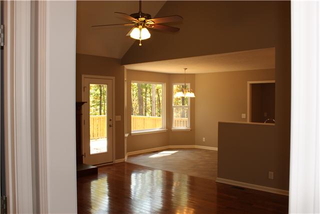 1331 Campbell Ridge Road Kingston Springs, TN 37082 - Photo 14 of 16 a view of empty room with wooden floor and fan