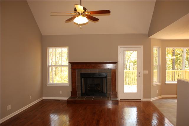 1331 Campbell Ridge Road Kingston Springs, TN 37082 - Photo 15 of 16 a view of an empty room with wooden floor and a window
