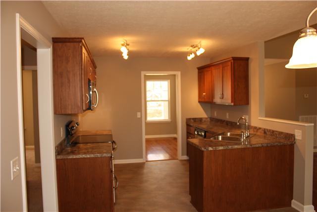 1331 Campbell Ridge Road Kingston Springs, TN 37082 - Photo 3 of 16 a kitchen with a refrigerator and a stove