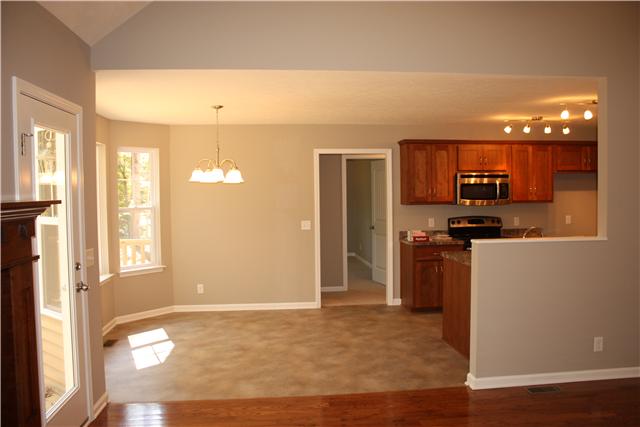 1331 Campbell Ridge Road Kingston Springs, TN 37082 - Photo 4 of 16 a kitchen with granite countertop a refrigerator and a stove top oven