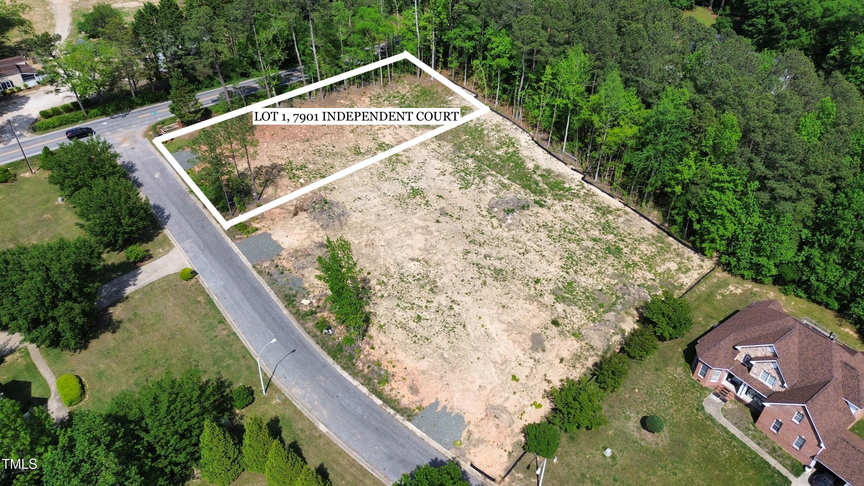 7901 Independent Court Garner, NC 27529 - Photo 1 of 14 a view of swimming pool with a garden