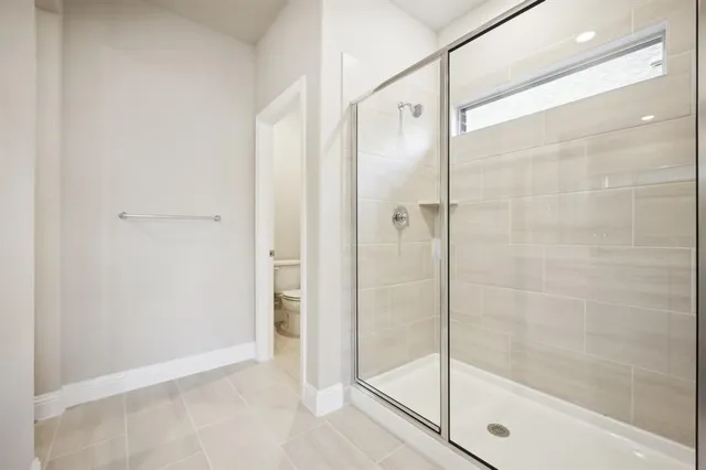 a bathroom with double sink and a mirror