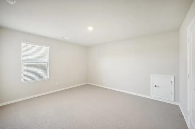a white bath tub sitting next to a toilet