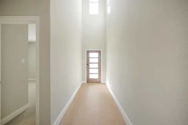 a view of a hallway with a window