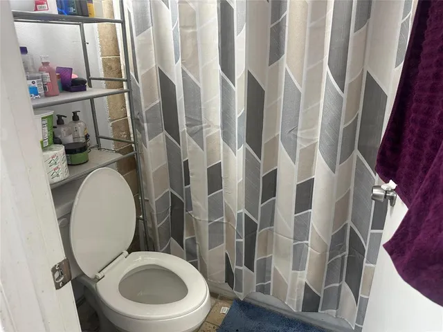a bathroom with a toilet and a sink