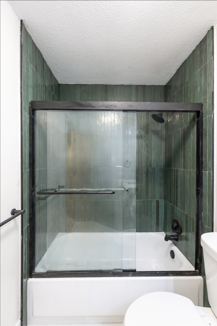 1339 North Dearborn Street, Unit 2B Chicago, IL 60610 - Photo 12 of 20 a bathroom with a bathtub and a shower