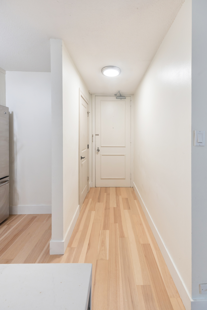 1339 North Dearborn Street, Unit 2B Chicago, IL 60610 - Photo 13 of 20 a view of a room with wooden floor and small space