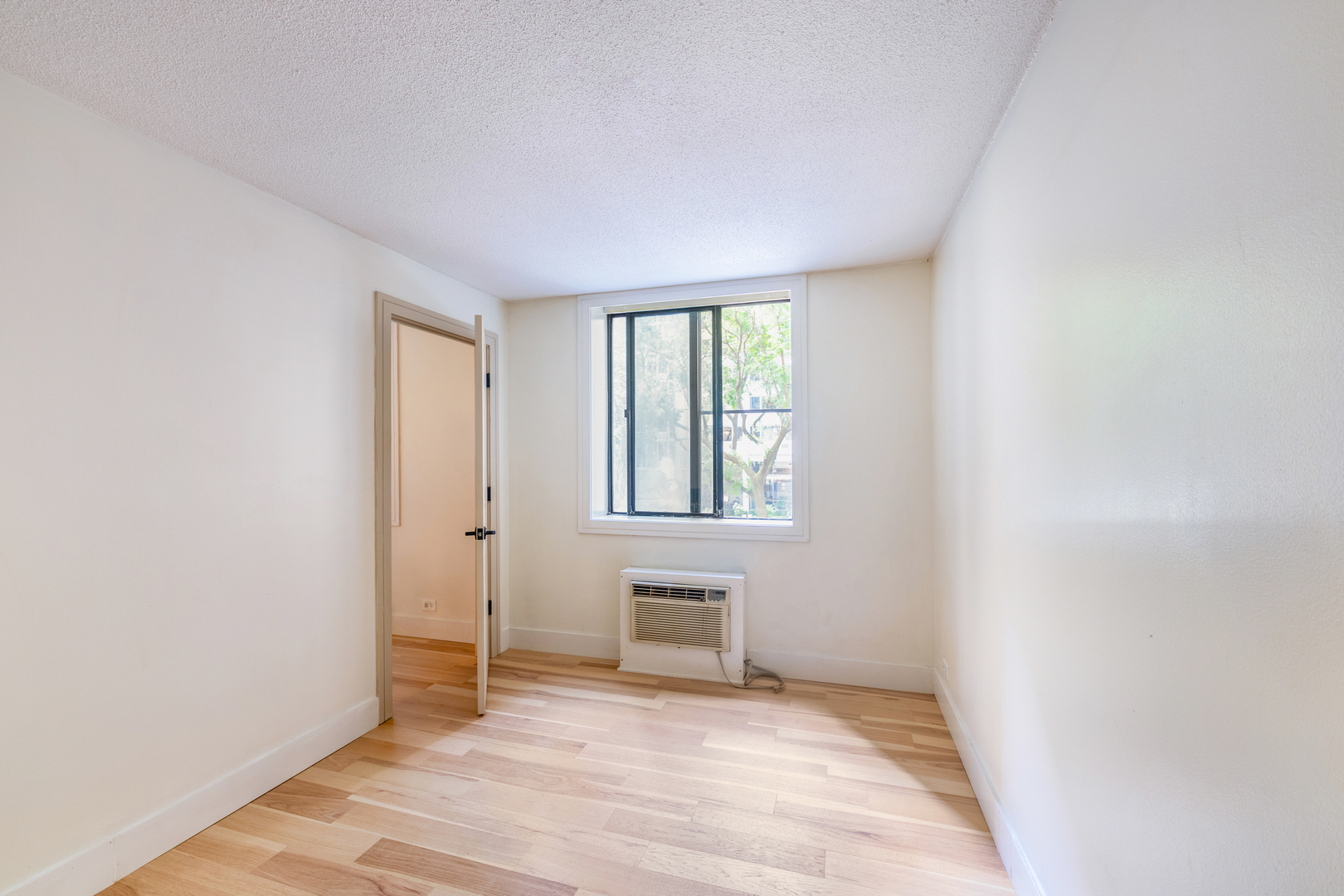 1339 North Dearborn Street, Unit 2B Chicago, IL 60610 - Photo 17 of 20 a view of an empty room with a window