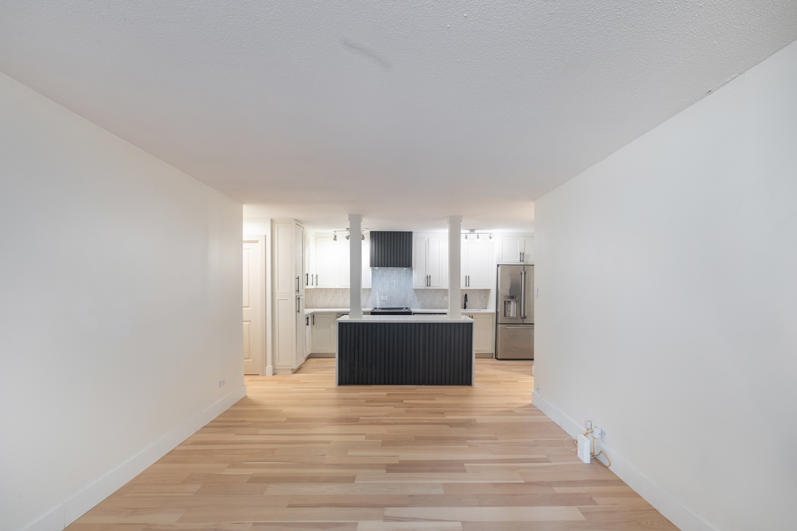 1339 North Dearborn Street, Unit 2B Chicago, IL 60610 - Photo 9 of 20 a view of a kitchen with a sink and a refrigerator
